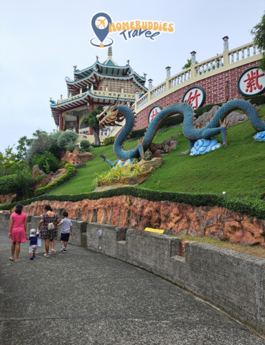 walking beside the dragon statue